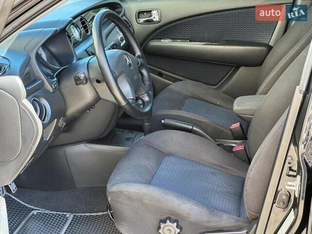 Черный Мицубиси Аутлендер, объемом двигателя 2.4 л и пробегом 252 тыс. км за 6990 $, фото 9 на Automoto.ua
