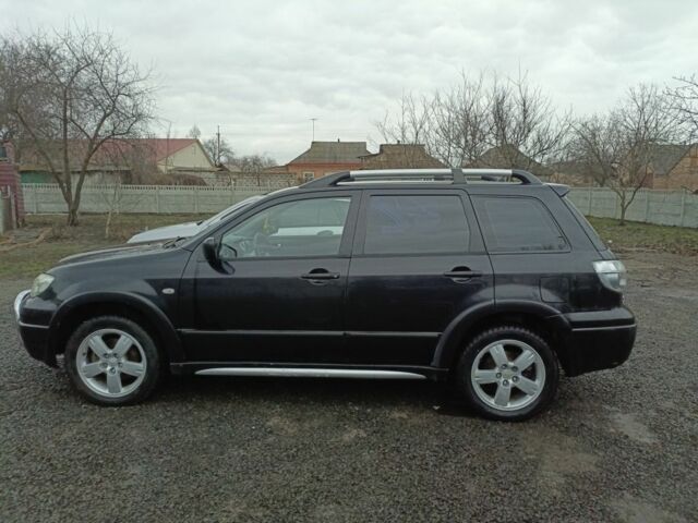 Черный Мицубиси Аутлендер, объемом двигателя 2 л и пробегом 200 тыс. км за 5100 $, фото 13 на Automoto.ua