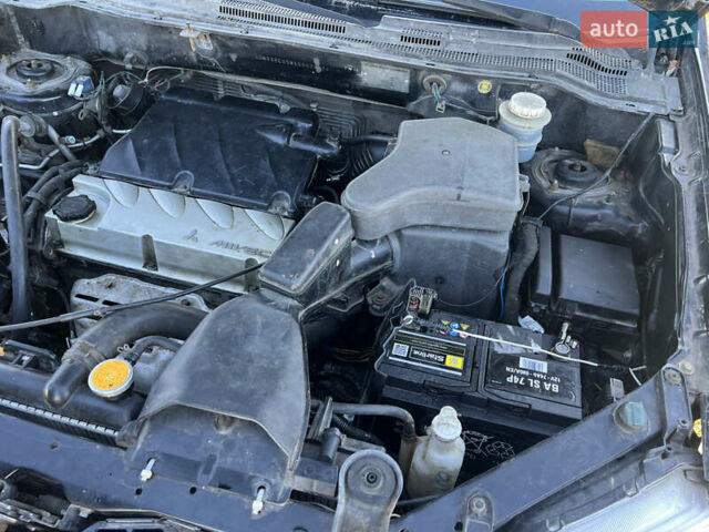 Черный Мицубиси Аутлендер, объемом двигателя 2.38 л и пробегом 230 тыс. км за 5350 $, фото 14 на Automoto.ua