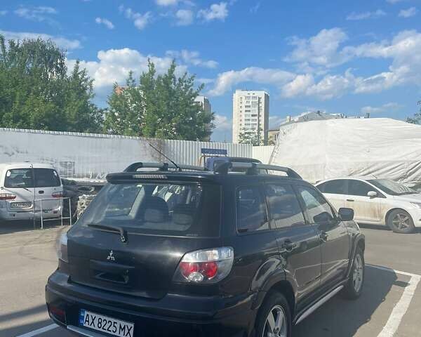Черный Мицубиси Аутлендер, объемом двигателя 2.38 л и пробегом 260 тыс. км за 5000 $, фото 3 на Automoto.ua