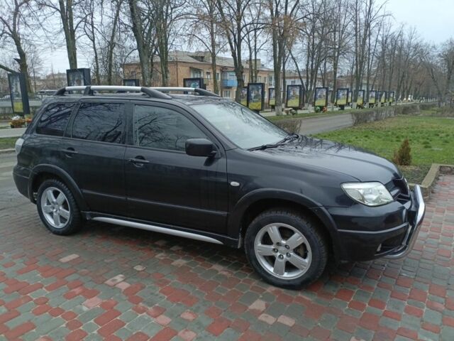 Черный Мицубиси Аутлендер, объемом двигателя 2 л и пробегом 200 тыс. км за 5100 $, фото 6 на Automoto.ua