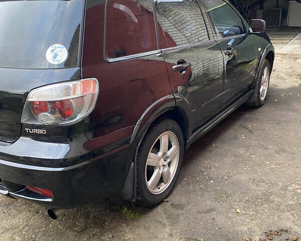 Міцубісі Аутлендер 2006 у Конотопе на Automoto.ua Чорний Міцубісі Аутлендер, об'ємом двигуна 2 л та пробігом 257 тис. км за 5800 $, фото 7 на Automoto.ua