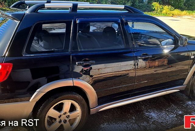 Черный Мицубиси Аутлендер, объемом двигателя 2.4 л и пробегом 185 тыс. км за 7500 $, фото 6 на Automoto.ua