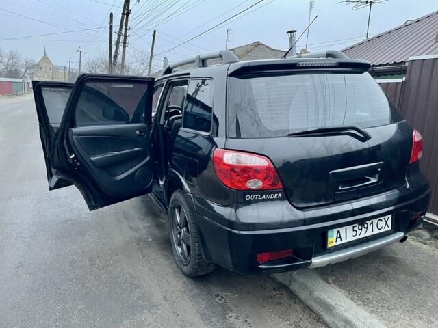 Черный Мицубиси Аутлендер, объемом двигателя 2.4 л и пробегом 234 тыс. км за 5499 $, фото 4 на Automoto.ua