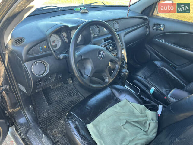 Черный Мицубиси Аутлендер, объемом двигателя 2.38 л и пробегом 230 тыс. км за 5350 $, фото 9 на Automoto.ua