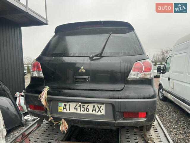 Черный Мицубиси Аутлендер, объемом двигателя 2.4 л и пробегом 240 тыс. км за 2200 $, фото 13 на Automoto.ua