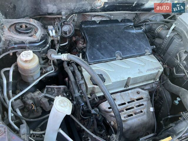 Черный Мицубиси Аутлендер, объемом двигателя 2.38 л и пробегом 230 тыс. км за 5350 $, фото 15 на Automoto.ua