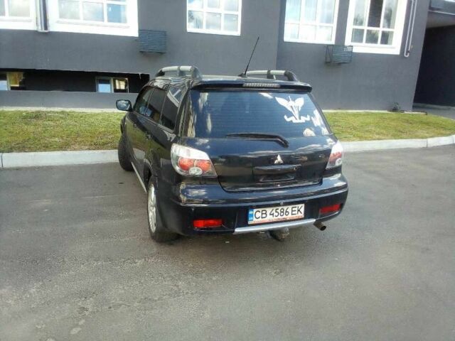 Черный Мицубиси Аутлендер, объемом двигателя 2.4 л и пробегом 240 тыс. км за 5700 $, фото 5 на Automoto.ua