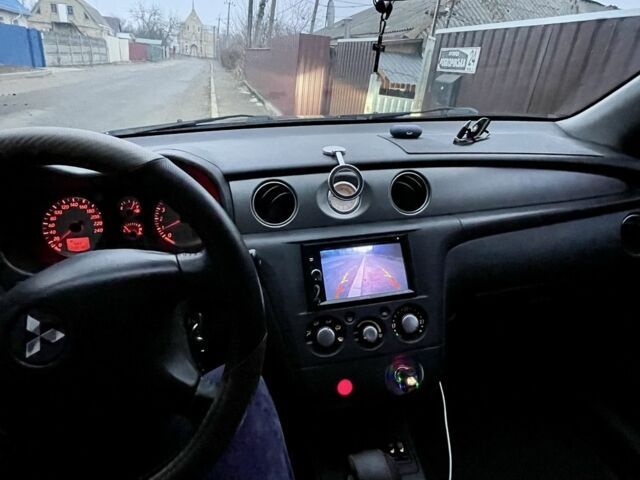 Черный Мицубиси Аутлендер, объемом двигателя 2.4 л и пробегом 234 тыс. км за 5499 $, фото 12 на Automoto.ua