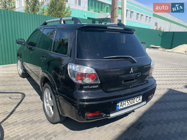 Черный Мицубиси Аутлендер, объемом двигателя 2 л и пробегом 212 тыс. км за 6000 $, фото 24 на Automoto.ua