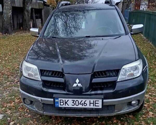 Чорний Міцубісі Аутлендер, об'ємом двигуна 2 л та пробігом 320 тис. км за 4500 $, фото 1 на Automoto.ua