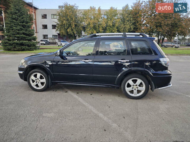 Чорний Міцубісі Аутлендер, об'ємом двигуна 2 л та пробігом 207 тис. км за 6900 $, фото 8 на Automoto.ua