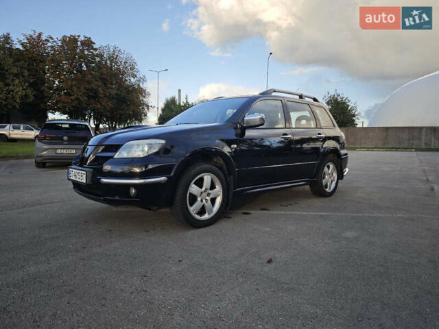 Чорний Міцубісі Аутлендер, об'ємом двигуна 2 л та пробігом 207 тис. км за 6900 $, фото 4 на Automoto.ua
