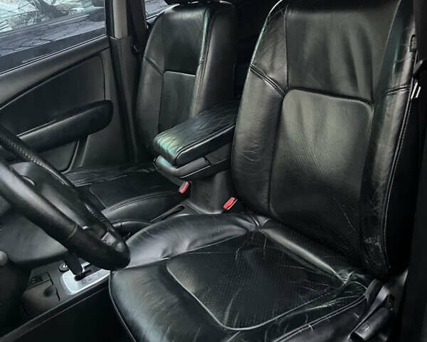 Чорний Міцубісі Аутлендер, об'ємом двигуна 2.38 л та пробігом 247 тис. км за 5499 $, фото 46 на Automoto.ua