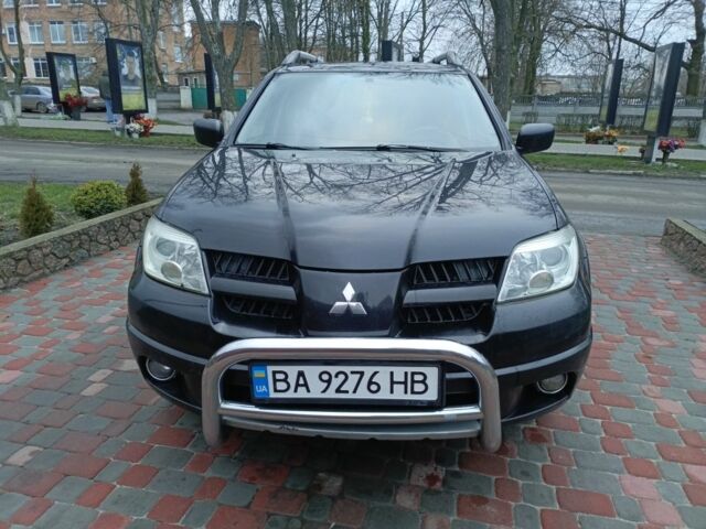 Черный Мицубиси Аутлендер, объемом двигателя 2 л и пробегом 200 тыс. км за 5100 $, фото 21 на Automoto.ua