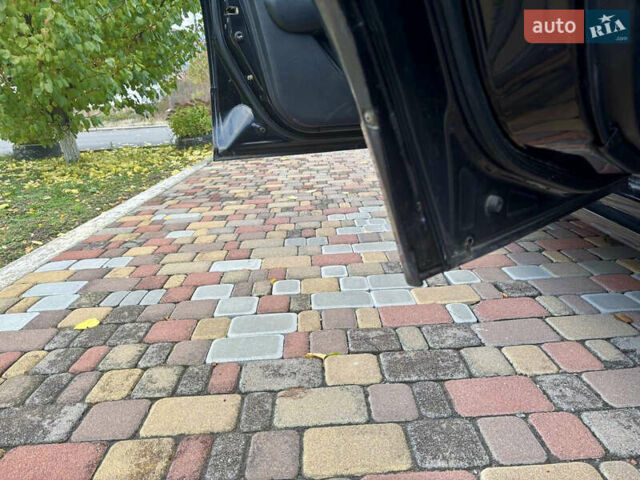 Чорний Міцубісі Аутлендер, об'ємом двигуна 2.38 л та пробігом 247 тис. км за 5499 $, фото 12 на Automoto.ua