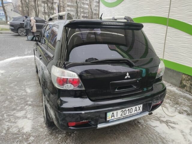 Чорний Міцубісі Аутлендер, об'ємом двигуна 2.4 л та пробігом 360 тис. км за 5200 $, фото 4 на Automoto.ua