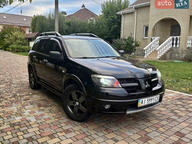 Чорний Міцубісі Аутлендер, об'ємом двигуна 2.38 л та пробігом 247 тис. км за 5499 $, фото 33 на Automoto.ua