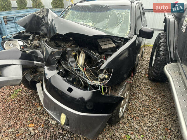 Черный Мицубиси Аутлендер, объемом двигателя 2.4 л и пробегом 240 тыс. км за 2200 $, фото 2 на Automoto.ua