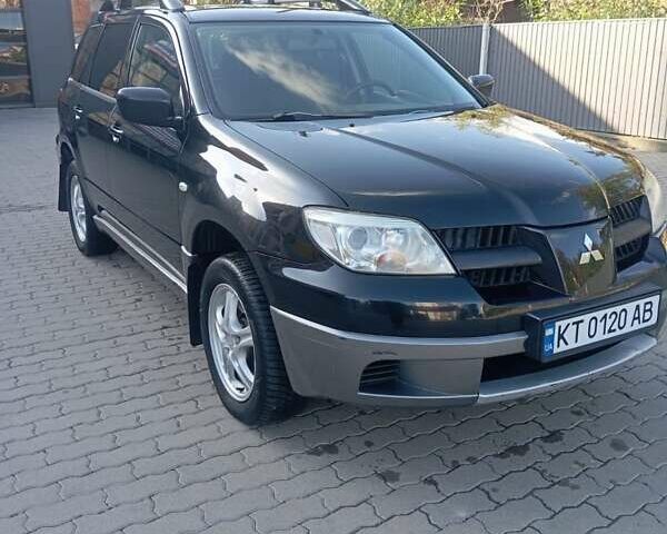 Черный Мицубиси Аутлендер, объемом двигателя 2 л и пробегом 297 тыс. км за 5800 $, фото 5 на Automoto.ua