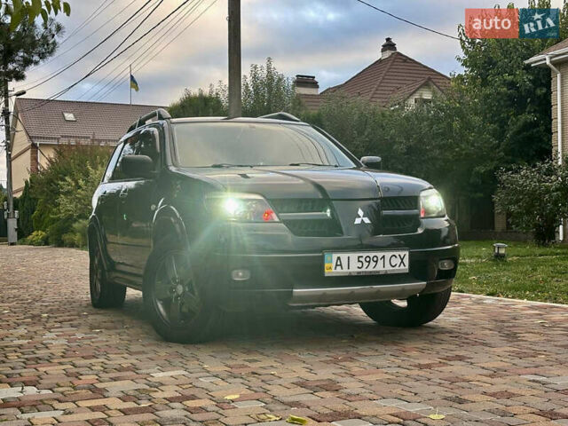 Чорний Міцубісі Аутлендер, об'ємом двигуна 2.38 л та пробігом 247 тис. км за 5499 $, фото 37 на Automoto.ua