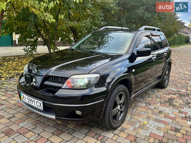 Чорний Міцубісі Аутлендер, об'ємом двигуна 2.38 л та пробігом 247 тис. км за 5499 $, фото 6 на Automoto.ua