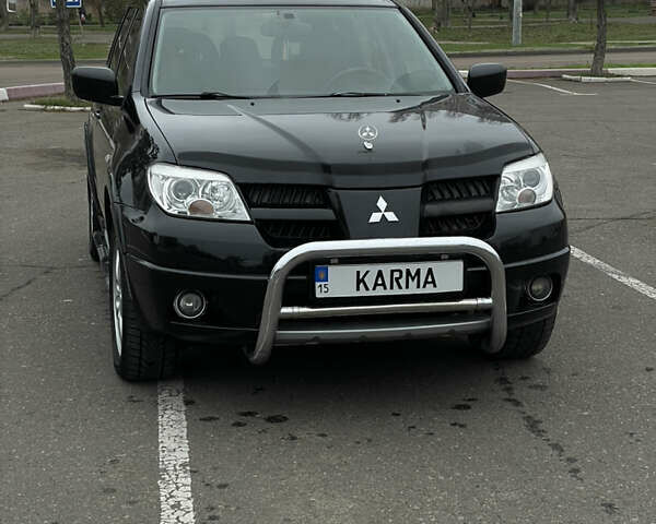 Чорний Міцубісі Аутлендер, об'ємом двигуна 2.38 л та пробігом 198 тис. км за 7100 $, фото 6 на Automoto.ua