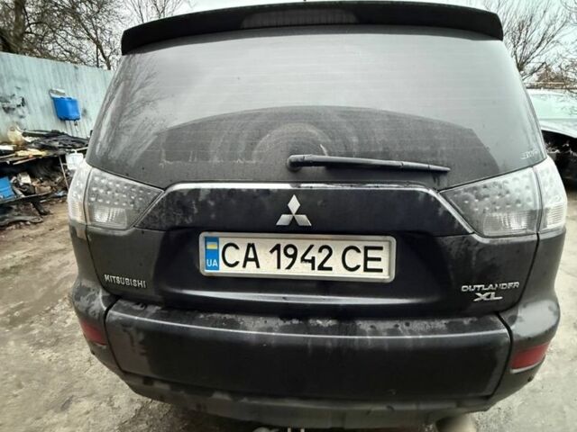 Чорний Міцубісі Аутлендер, об'ємом двигуна 2.4 л та пробігом 215 тис. км за 8300 $, фото 1 на Automoto.ua