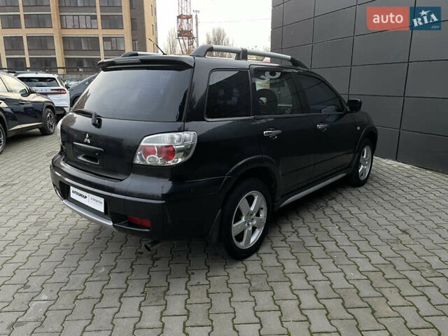 Черный Мицубиси Аутлендер, объемом двигателя 2.4 л и пробегом 248 тыс. км за 7300 $, фото 22 на Automoto.ua