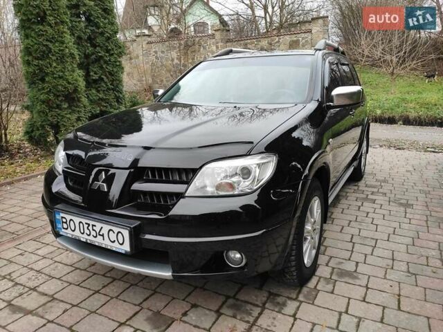 Черный Мицубиси Аутлендер, объемом двигателя 2 л и пробегом 180 тыс. км за 6000 $, фото 4 на Automoto.ua