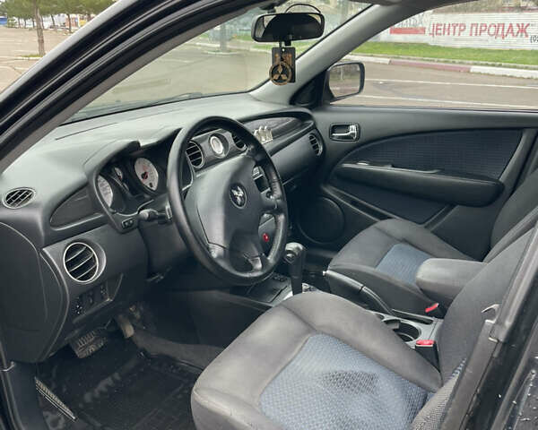 Чорний Міцубісі Аутлендер, об'ємом двигуна 2.38 л та пробігом 198 тис. км за 7100 $, фото 8 на Automoto.ua