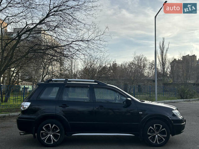 Черный Мицубиси Аутлендер, объемом двигателя 2.4 л и пробегом 320 тыс. км за 5999 $, фото 3 на Automoto.ua