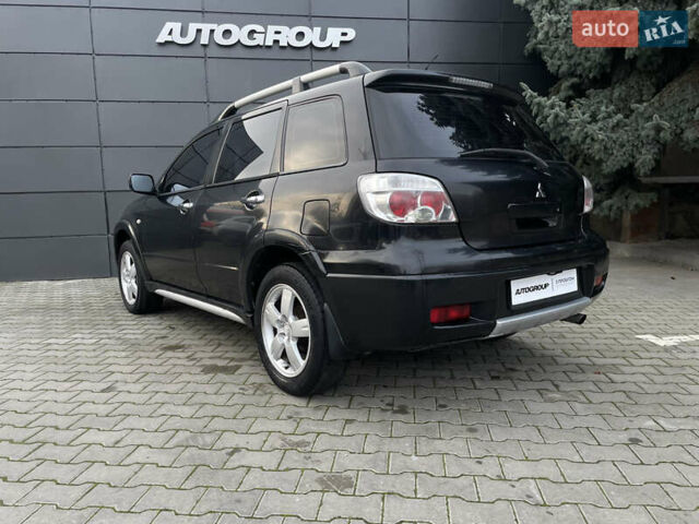 Черный Мицубиси Аутлендер, объемом двигателя 2.4 л и пробегом 248 тыс. км за 7300 $, фото 19 на Automoto.ua