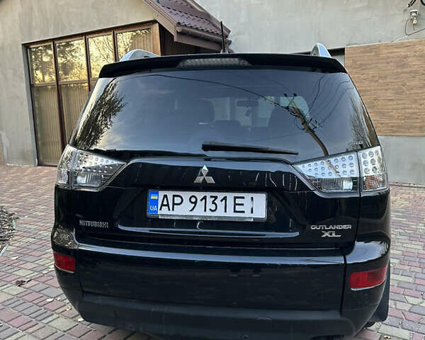 Чорний Міцубісі Аутлендер, об'ємом двигуна 3 л та пробігом 238 тис. км за 11200 $, фото 1 на Automoto.ua