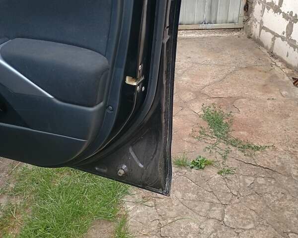 Черный Мицубиси Аутлендер, объемом двигателя 1.97 л и пробегом 218 тыс. км за 10500 $, фото 6 на Automoto.ua