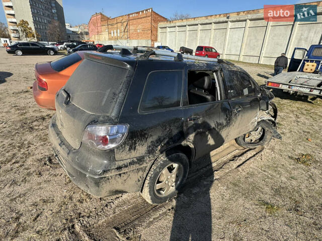 Черный Мицубиси Аутлендер, объемом двигателя 2 л и пробегом 258 тыс. км за 2200 $, фото 7 на Automoto.ua