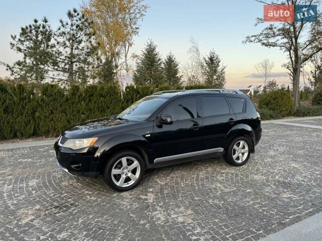 Черный Мицубиси Аутлендер, объемом двигателя 3 л и пробегом 205 тыс. км за 11300 $, фото 1 на Automoto.ua
