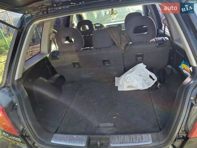 Чорний Міцубісі Аутлендер, об'ємом двигуна 2 л та пробігом 260 тис. км за 5500 $, фото 6 на Automoto.ua
