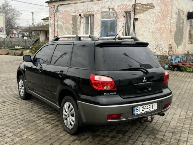 Чорний Міцубісі Аутлендер, об'ємом двигуна 2 л та пробігом 220 тис. км за 6299 $, фото 4 на Automoto.ua