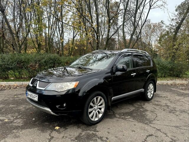 Черный Мицубиси Аутлендер, объемом двигателя 2.4 л и пробегом 230 тыс. км за 8500 $, фото 2 на Automoto.ua