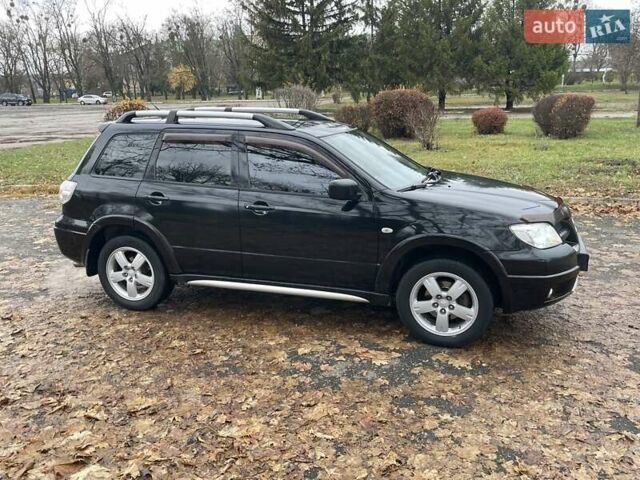 Чорний Міцубісі Аутлендер, об'ємом двигуна 2.4 л та пробігом 213 тис. км за 6850 $, фото 5 на Automoto.ua