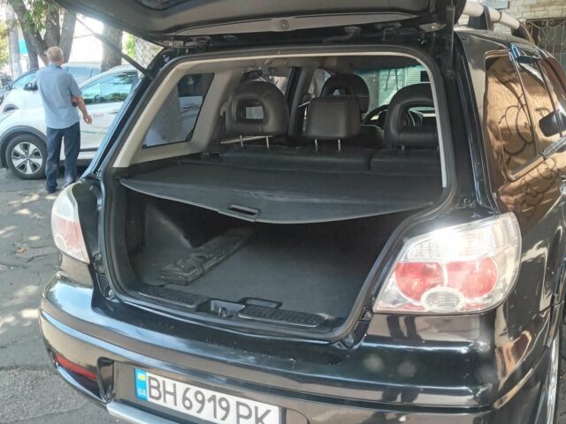 Черный Мицубиси Аутлендер, объемом двигателя 2.4 л и пробегом 248 тыс. км за 7000 $, фото 4 на Automoto.ua