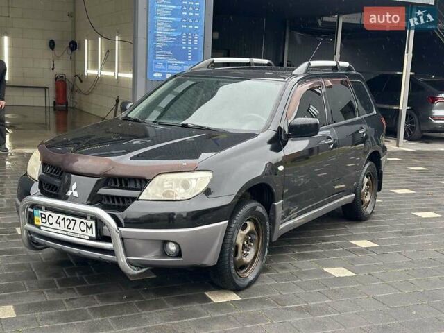 Черный Мицубиси Аутлендер, объемом двигателя 2 л и пробегом 295 тыс. км за 5300 $, фото 15 на Automoto.ua