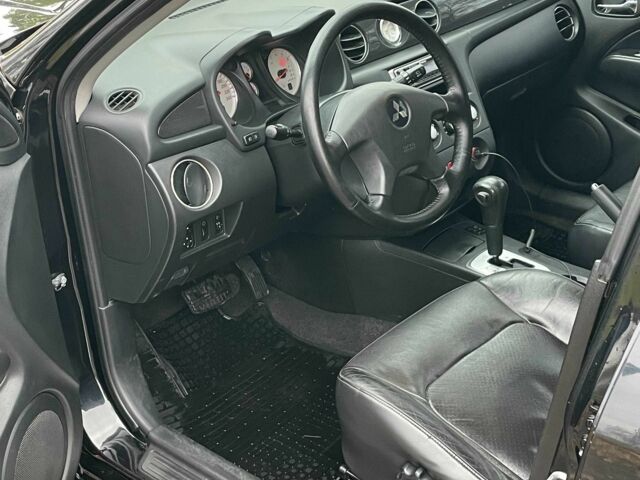 Черный Мицубиси Аутлендер, объемом двигателя 2.4 л и пробегом 213 тыс. км за 6850 $, фото 12 на Automoto.ua