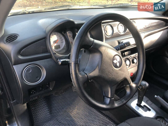 Черный Мицубиси Аутлендер, объемом двигателя 2.4 л и пробегом 260 тыс. км за 7200 $, фото 18 на Automoto.ua