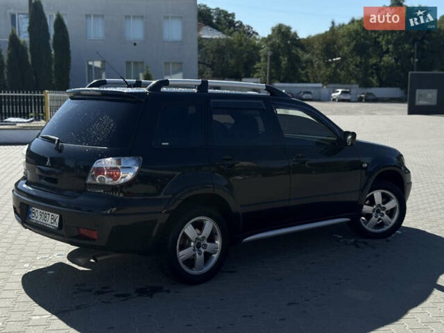Чорний Міцубісі Аутлендер, об'ємом двигуна 2 л та пробігом 280 тис. км за 7500 $, фото 4 на Automoto.ua