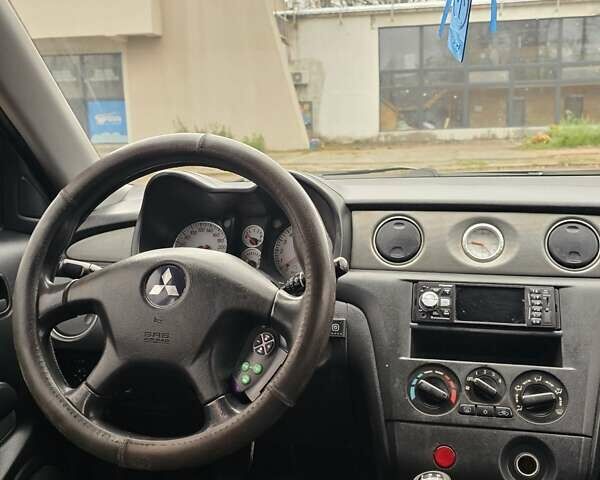 Чорний Міцубісі Аутлендер, об'ємом двигуна 2 л та пробігом 290 тис. км за 5000 $, фото 14 на Automoto.ua