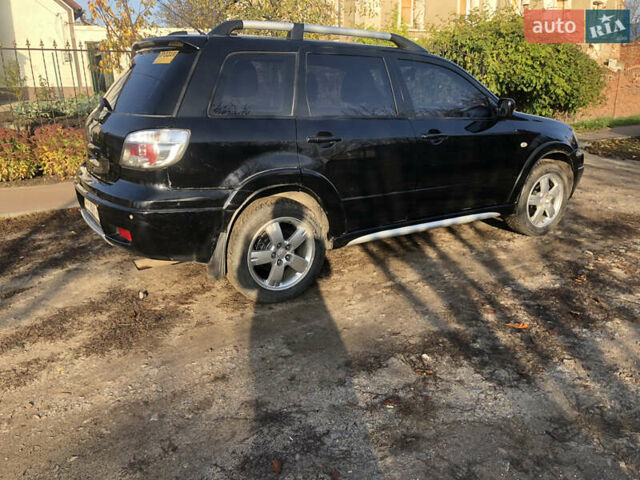 Черный Мицубиси Аутлендер, объемом двигателя 2.4 л и пробегом 260 тыс. км за 7200 $, фото 7 на Automoto.ua