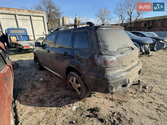 Черный Мицубиси Аутлендер, объемом двигателя 2 л и пробегом 258 тыс. км за 2200 $, фото 5 на Automoto.ua