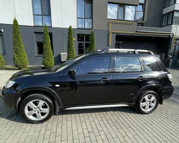 Черный Мицубиси Аутлендер, объемом двигателя 2.38 л и пробегом 310 тыс. км за 7500 $, фото 2 на Automoto.ua